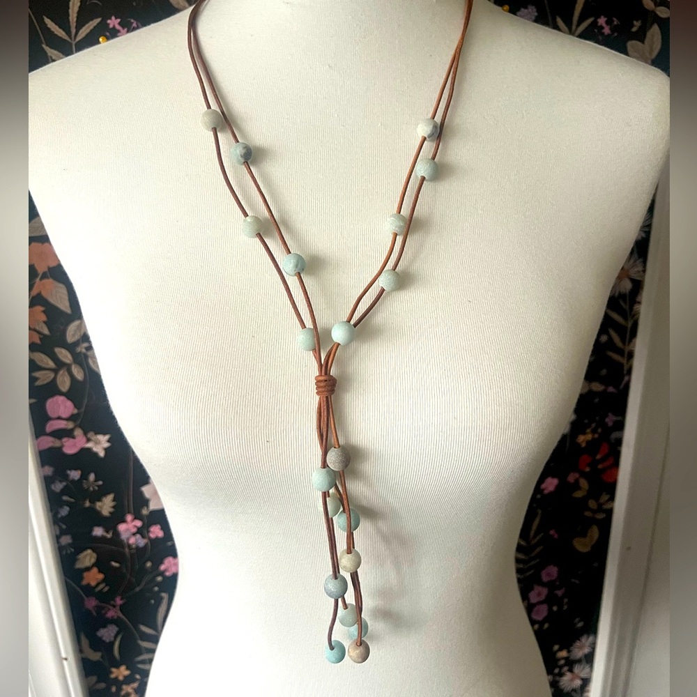 Leather strands with stone beads: aqua, green, brown.